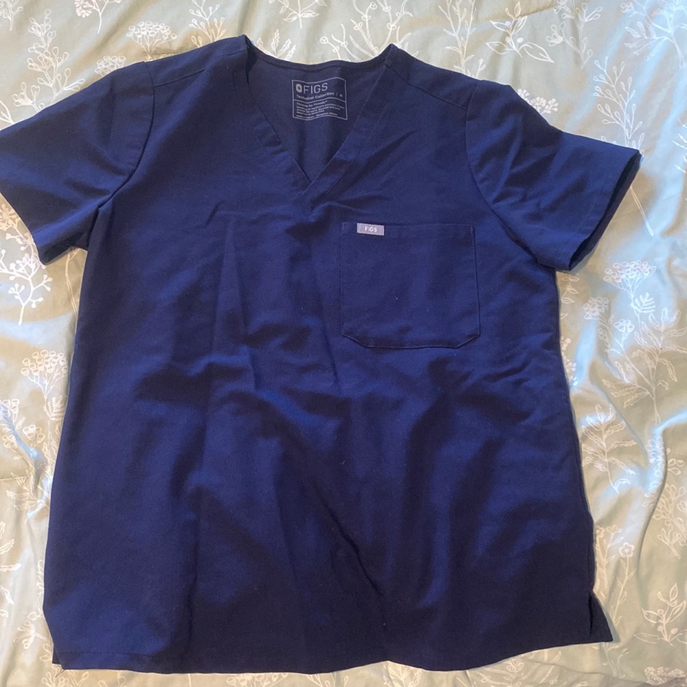 figs navy blue scrub top. worn once. washed. not correct size for me.